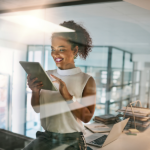Professional accessing structured digital workspace on tablet in bright office environment
